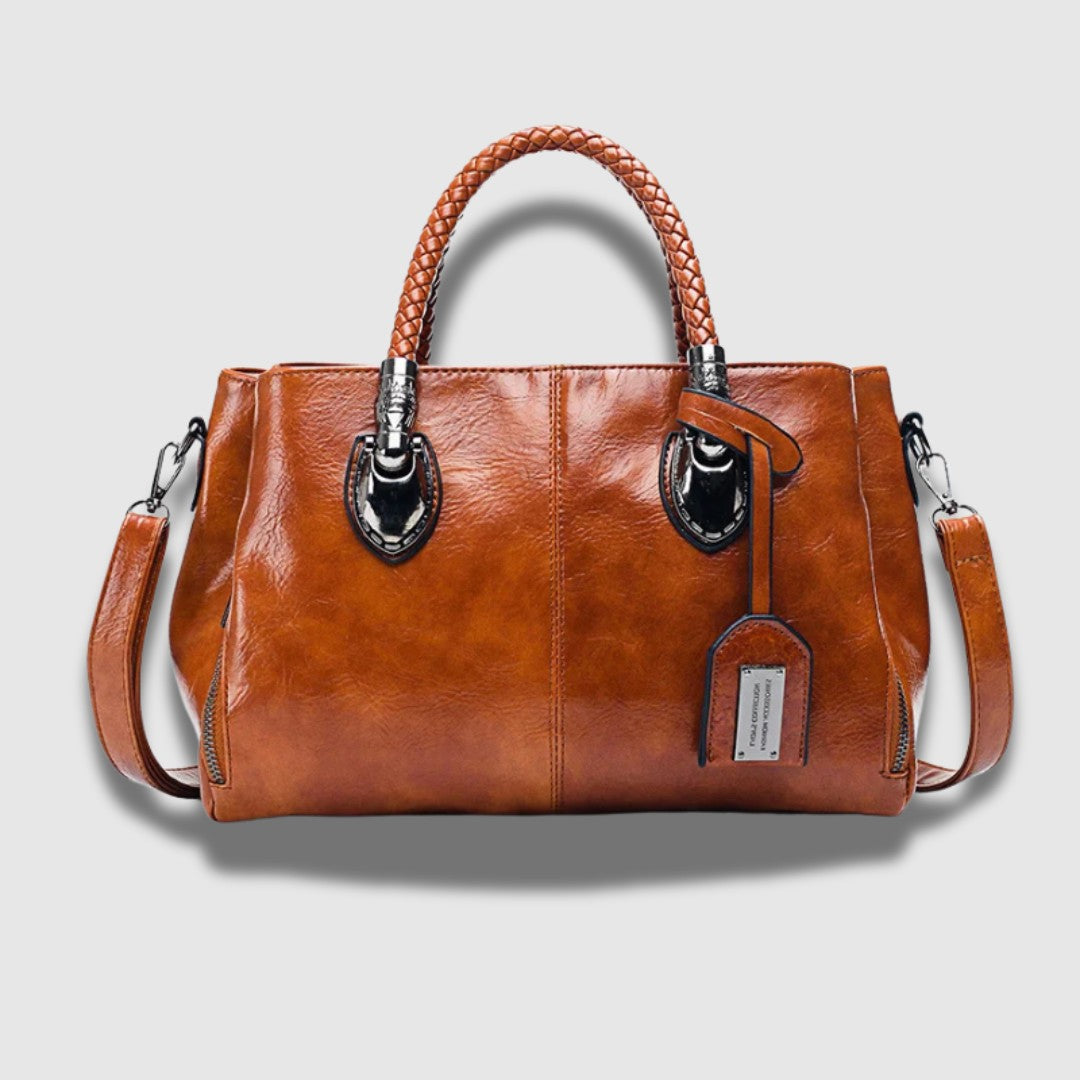 Leren clutch met gevlochten handvat – ruim, chic en omvormbaar