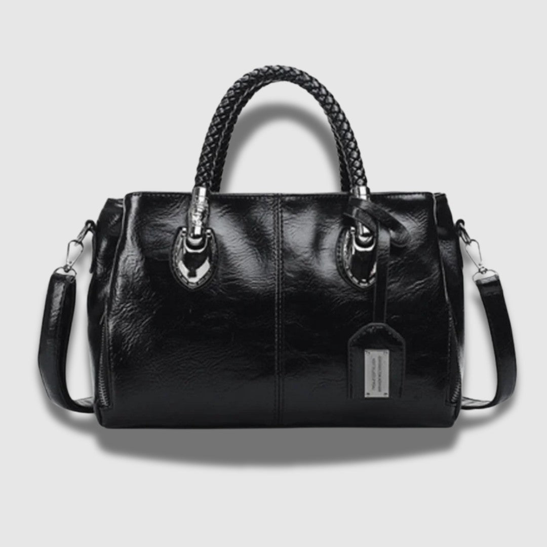 Leren clutch met gevlochten handvat – ruim, chic en omvormbaar