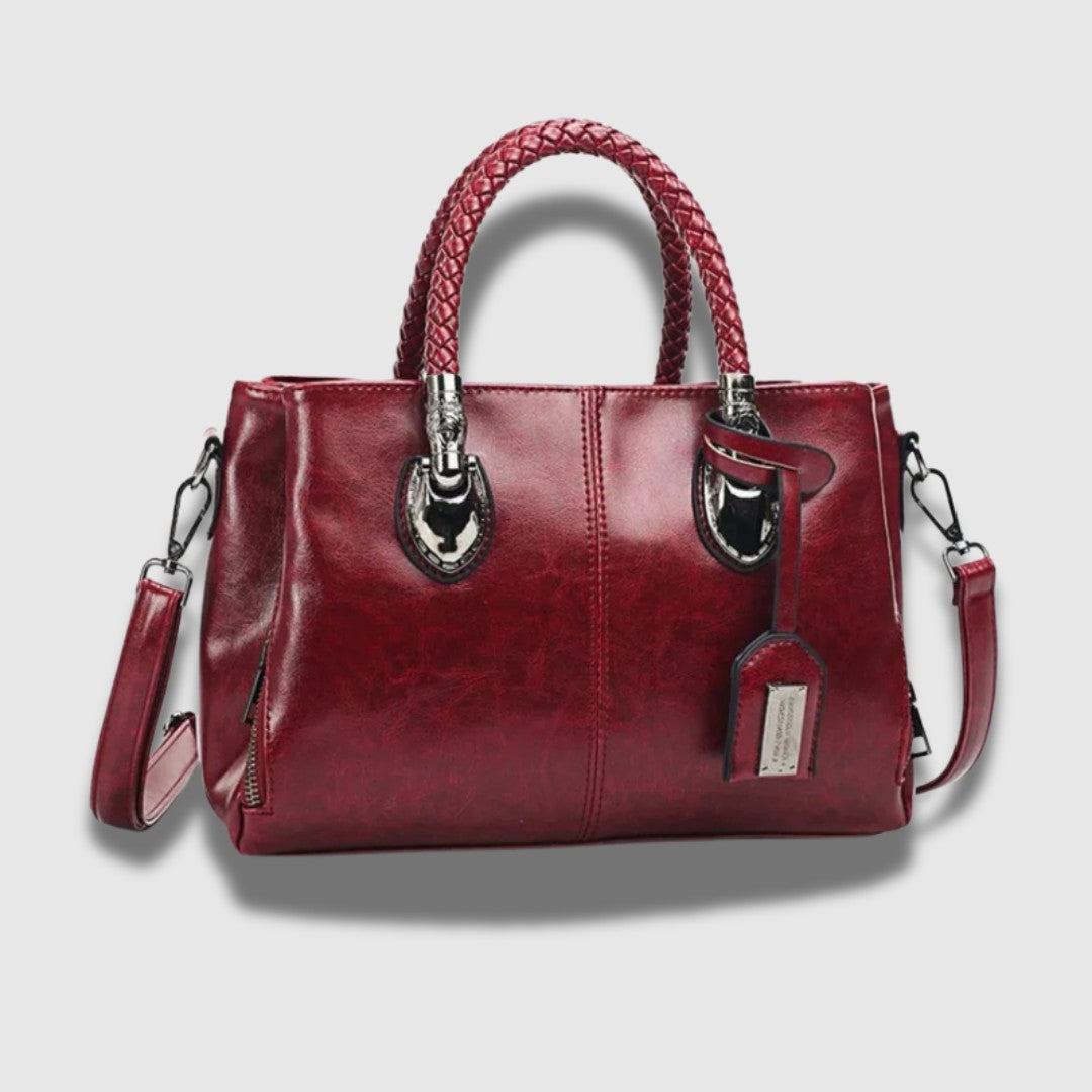 Leren clutch met gevlochten handvat – ruim, chic en omvormbaar